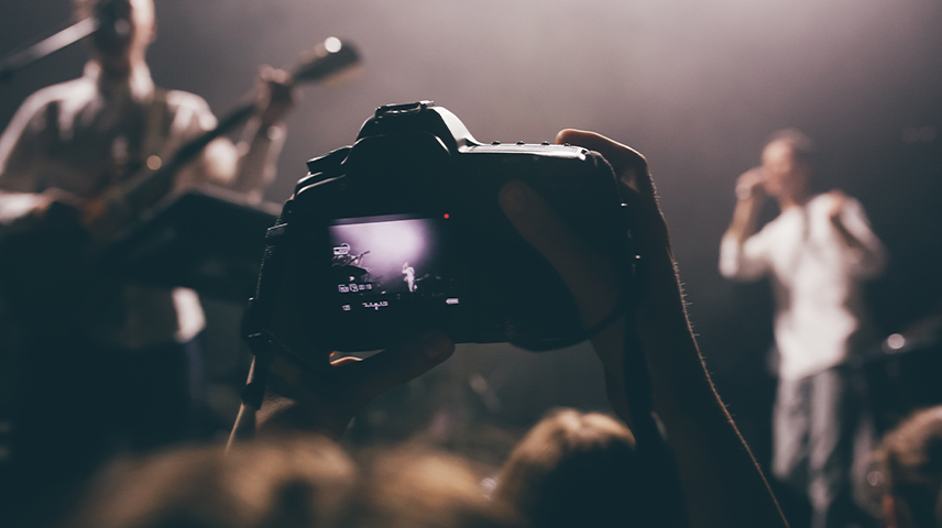 Professional event photographer at work in Qatar corporate event